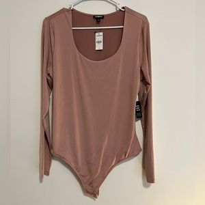 Pink long sleeve bodysuit from Express. Brand new with tags. Size large